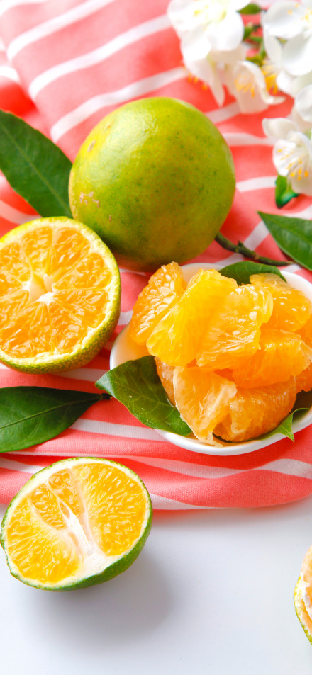 Bright Citrus Fruit with Leaves 4K Phone Background