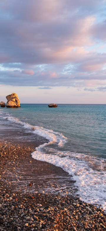 Cyprus Aphrodite's Rock coastal landscape wallpaper: waves, pebble beach with rocks
