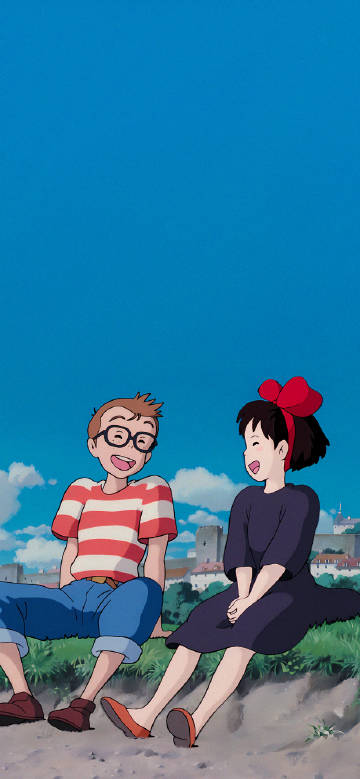 Kiki and Friend Enjoying a Laugh Under a Bright Blue Sky Wallpaper
