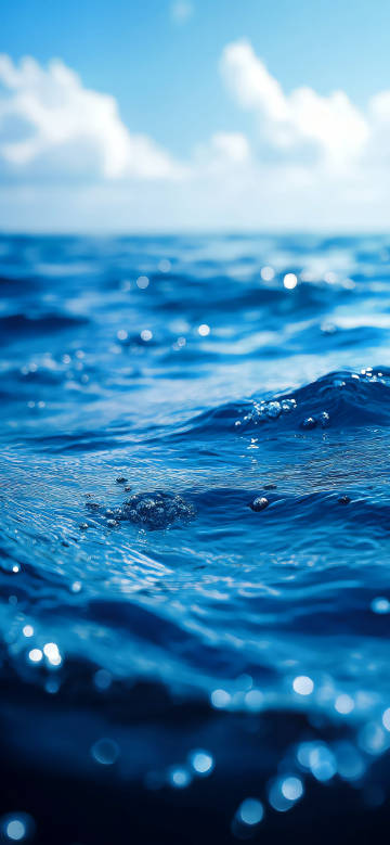Calm sea blue sky blurred background phone wallpaper