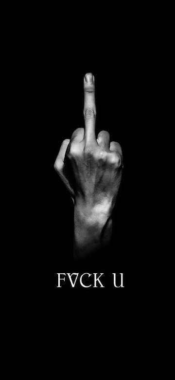 Hand with middle finger up on black background