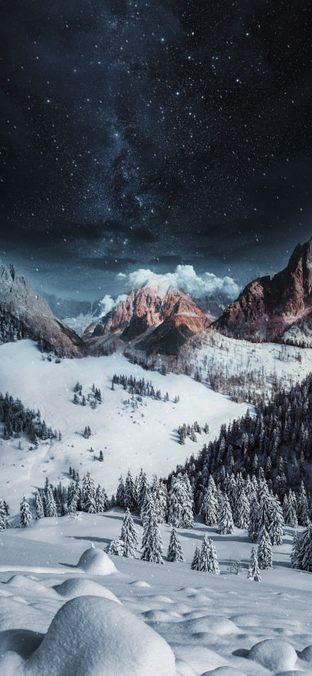 Snow-covered mountains on a starry night phone wallpaper