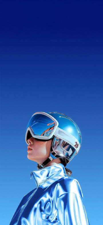 Girl in a blue jacket and a blue ski helmet phone wallpaper