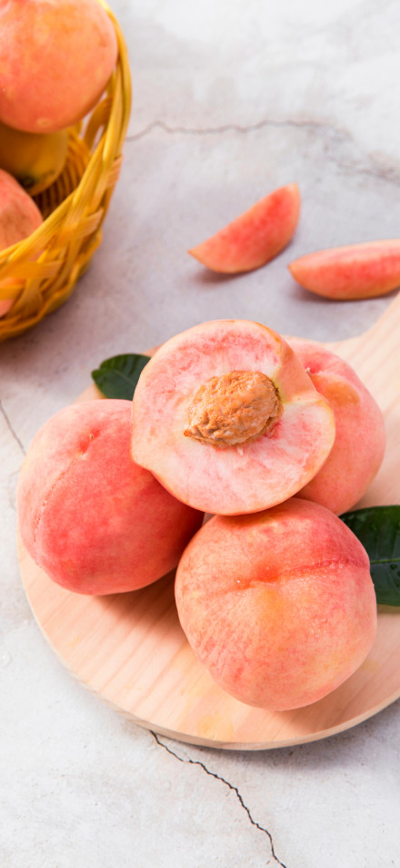 Fresh Pink Peaches on Wooden Plate 4K Phone Wallpaper