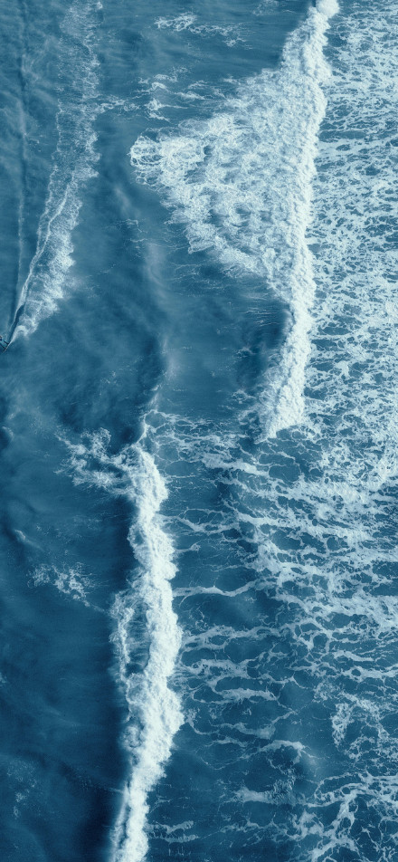 Aerial view of white waves on the sea wallpaper