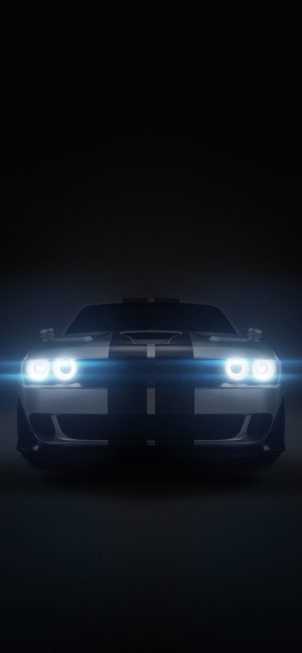 A silver-grey car with bright blue headlights phone wallpaper
