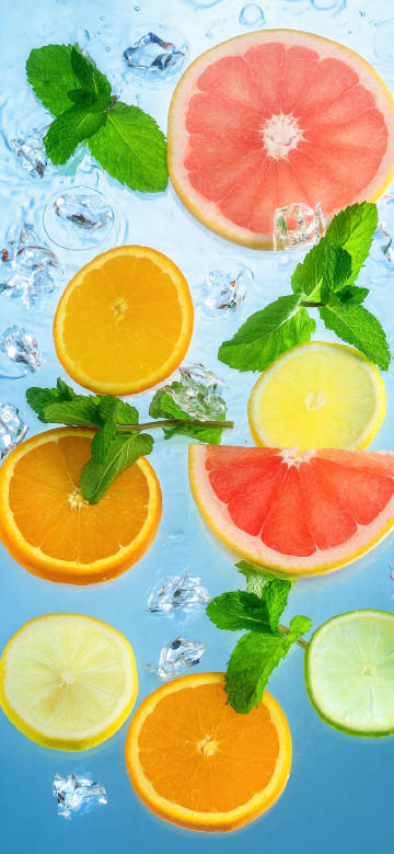 Lemon slices and mint floating on ice water phone wallpaper