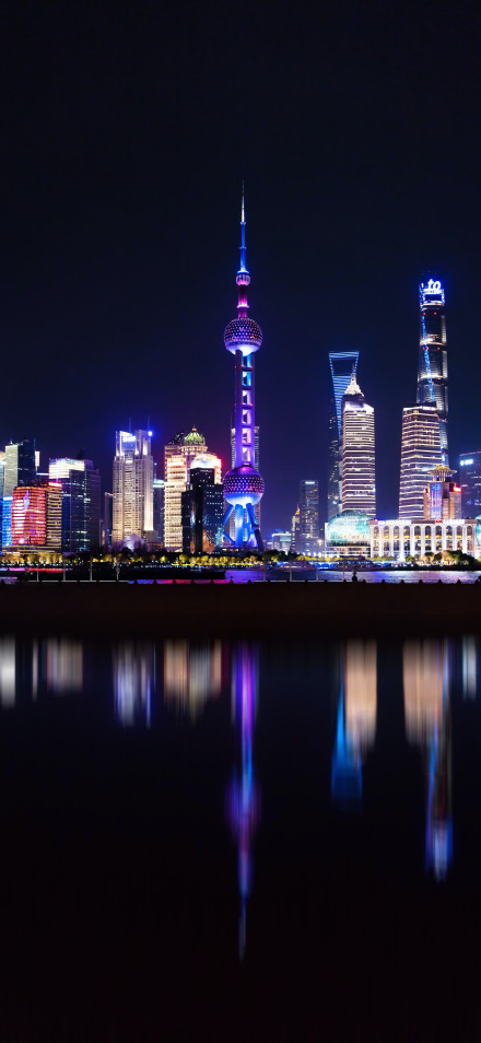 Vibrant Shanghai Pudong Cityscape At Night Wallpaper