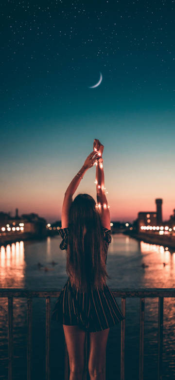 Girl's back on the riverside at moonlit night phone wallpaper