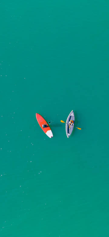 Paddleboard and kayak journey on blue water phone wallpaper