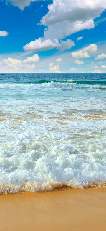 Seaside waves scenery under clear sky phone wallpaper