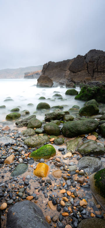 Misty seaside rocky beach phone wallpaper