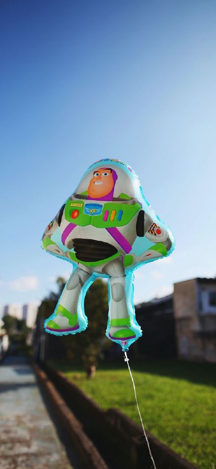 Buzz Lightyear Balloon Floating Under Blue Sky Depth Effect Wallpaper