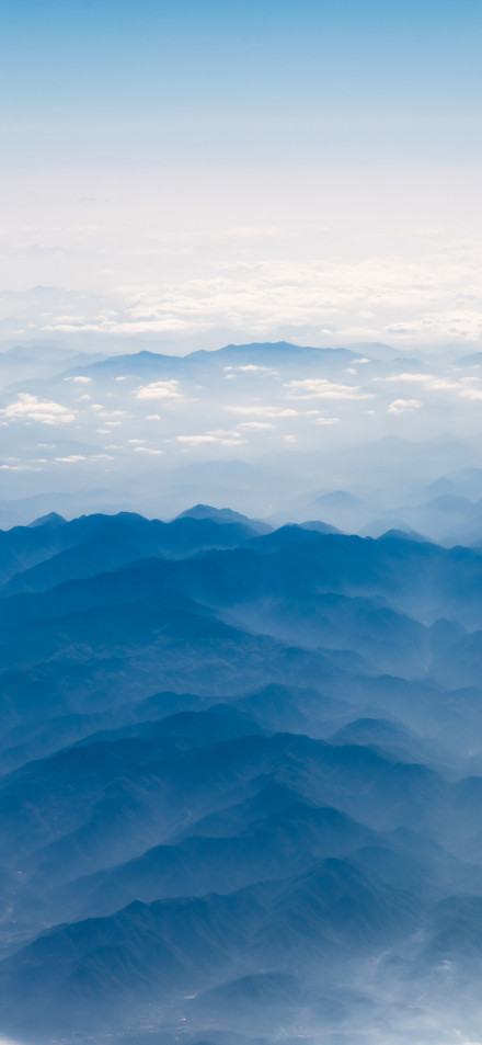 Aerial View of Misty Blue Mountains 4K Phone Wallpaper