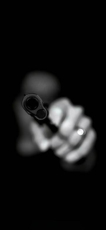 One hand holding a gun pointing forward phone wallpaper