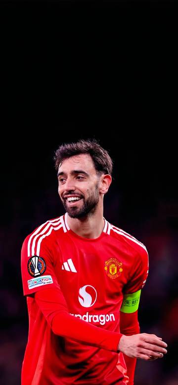 Portuguese football player Bruno Fernandes with a confident smile phone wallpaper