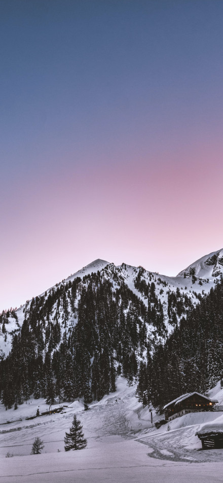 Snow mountain under pink sky