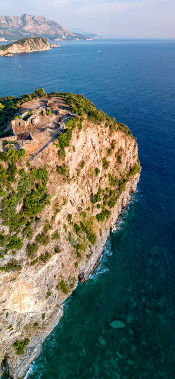 Aerial coastal scenery wallpaper: cliffs, ruins and vast ocean