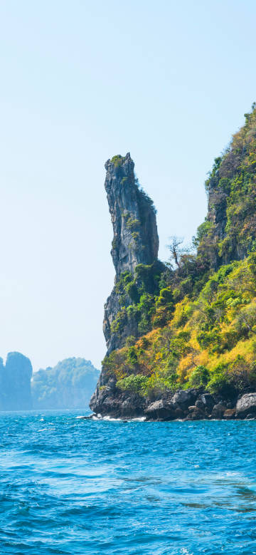 Strange rocky peaks rise above the azure sea