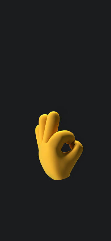 An OK gesture on a dark background