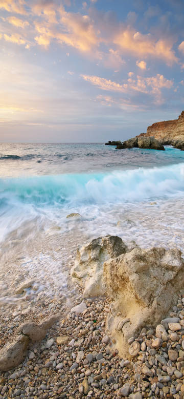 Turquoise Waves Under Blue Skies and White Clouds 4K Phone Wallpaper
