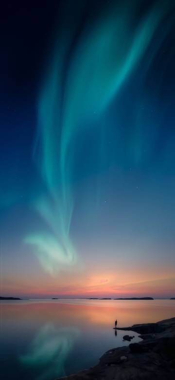 Magnificent scenery of aurora dancing in the night sky phone wallpaper