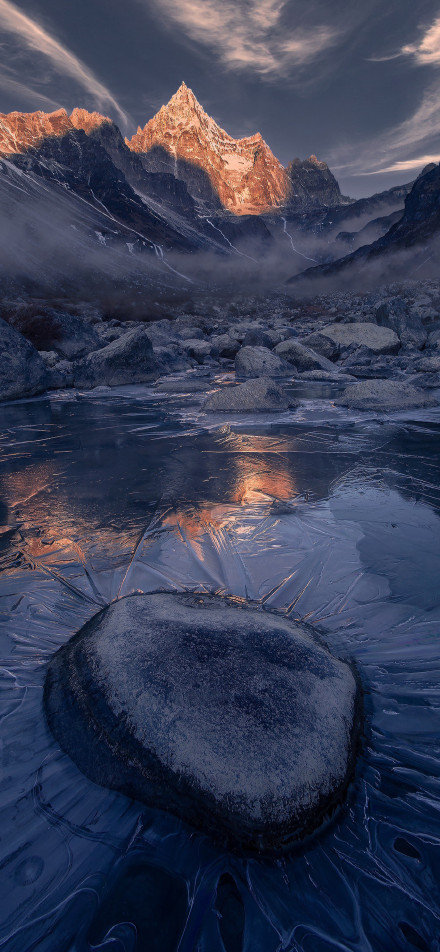 Snow-mountain wonder among ice and rocks phone wallpaper