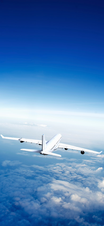 Airplane Flying Above the Clouds 4K Phone Wallpaper