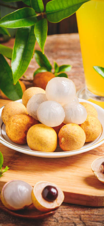 Fresh Longan Fruit on Wooden Table 4K Phone Wallpaper