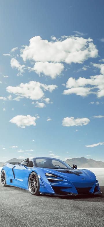 Blue Supercar Mclaren on Open Road under Sunny Sky