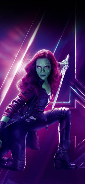 Gamora in combat gear and holding a weapon