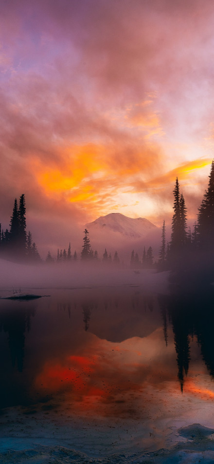 Snowy mountain lake view under a pink-purple sky wallpaper