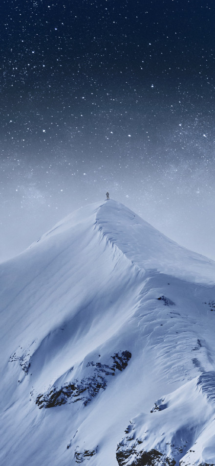 Person on the snowy mountain peak phone wallpaper