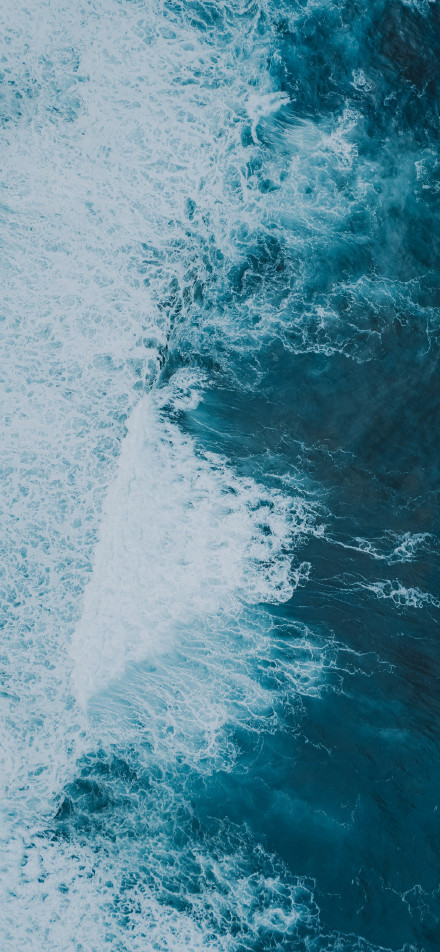 Aerial photography of ocean waves phone wallpaper