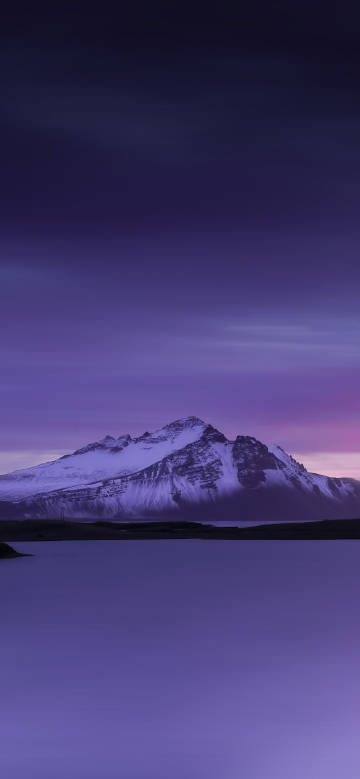 Amazing scene of Snow-capped mountains in purple night