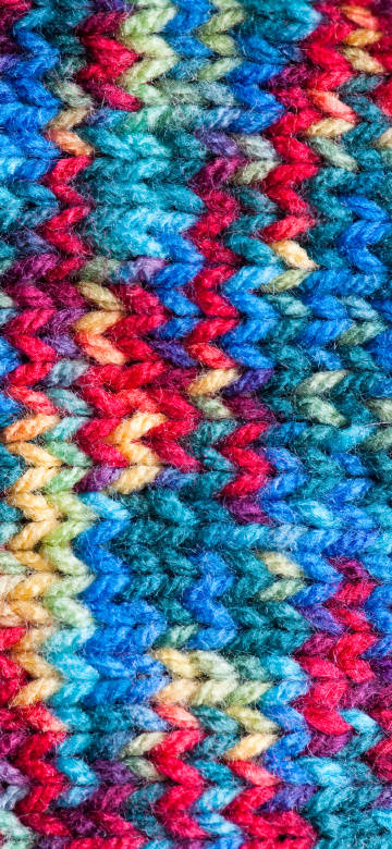 A colorful piece of woven fabric phone wallpaper