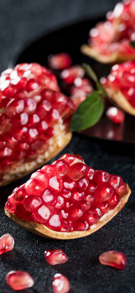 Fresh Pomegranate Seeds Close-Up 4K Phone Wallpaper