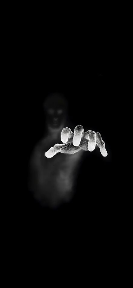 Glowing Hand Emerging from the Darkness Wallpaper