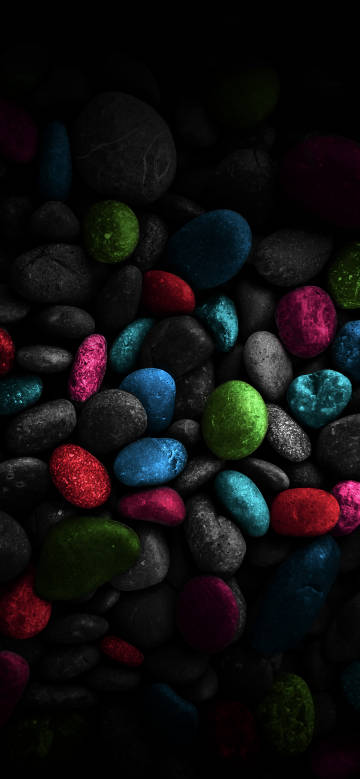Stones of various colors on a black background phone wallpaper