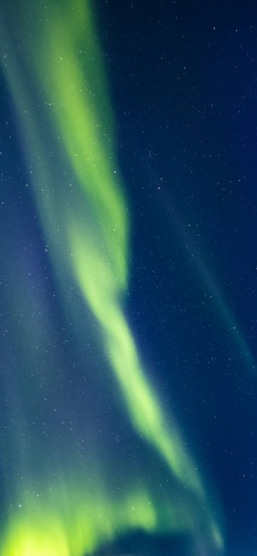Green aurora dancing in the night sky under the stars phone wallpaper