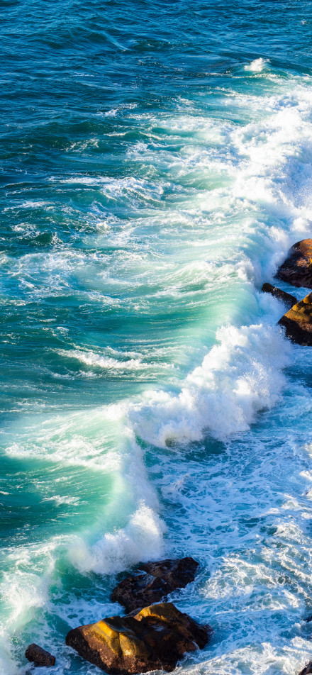 Turquoise Sea with White Waves 4K Phone Wallpaper