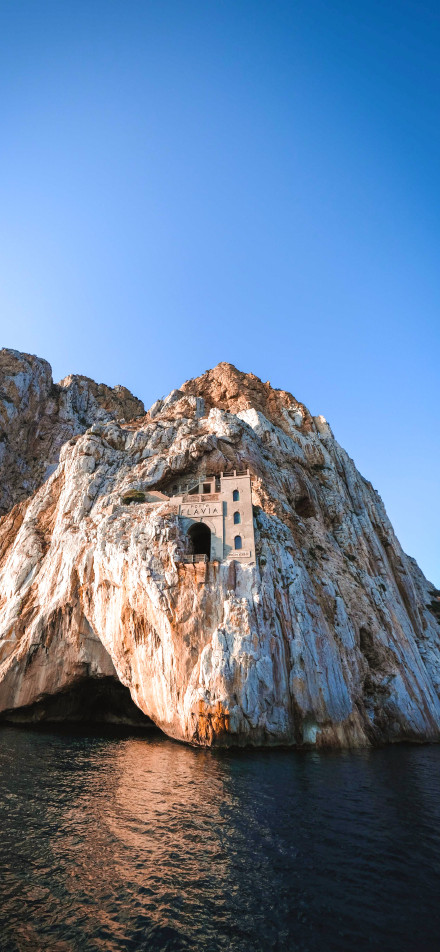Mysterious building on the cliff phone wallpaper