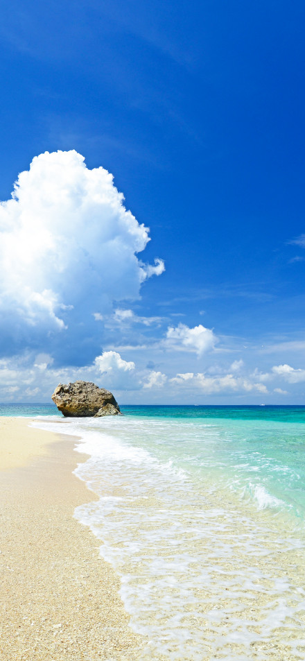 Beach under blue sky and white clouds phone wallpaper