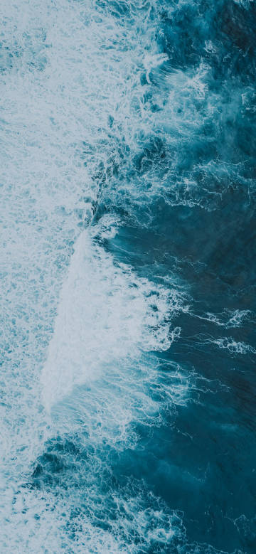 Aerial photography of ocean waves phone wallpaper