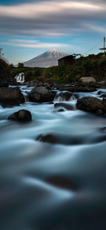 A fast-flowing stream under Mount Fuji phone wallpaper