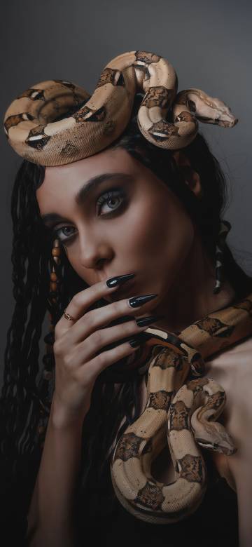 Two snakes entangled around a woman phone wallpaper