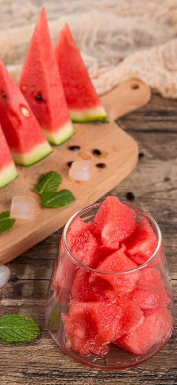 Sliced watermelon in a glass bowl 4K phone wallpaper
