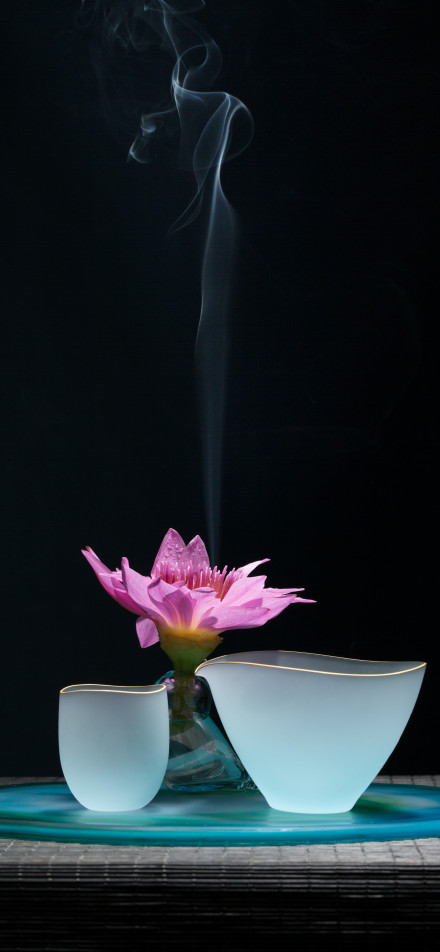 Pink lotus white cup black background phone wallpaper