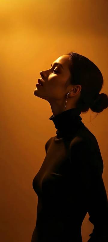Woman in Black Turtleneck Under Golden Light Profile Wallpaper