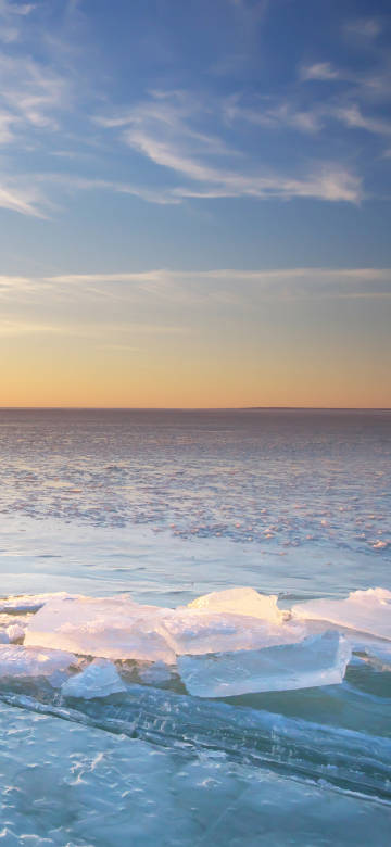 Frozen lake at sunset 4k phone wallpaper